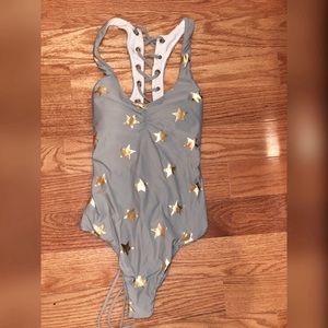 Star patterned one piece lace up swimming suit